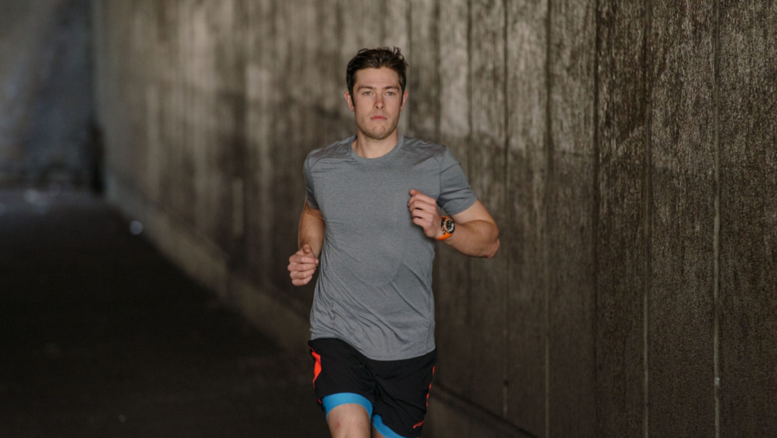 man running in tunnel