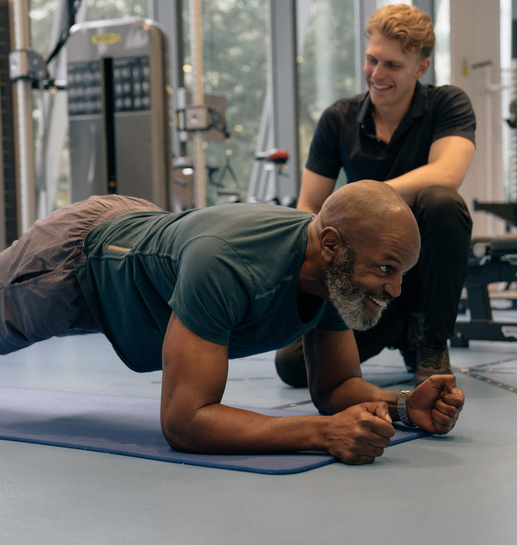 a man doing a plank in a gym