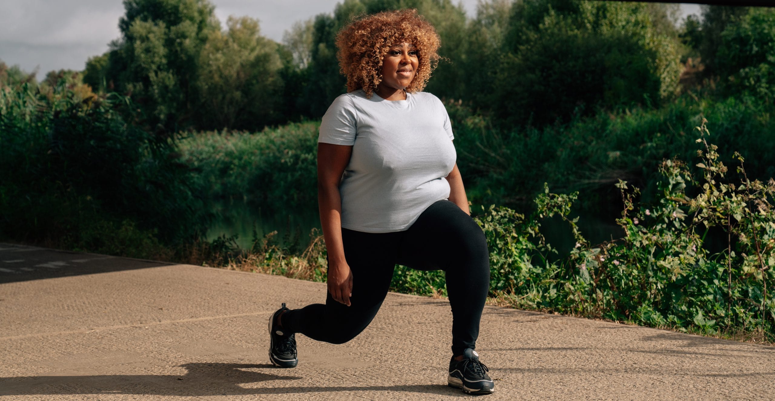 a woman stretching outside