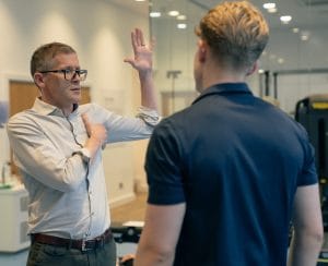 a man with his arm up