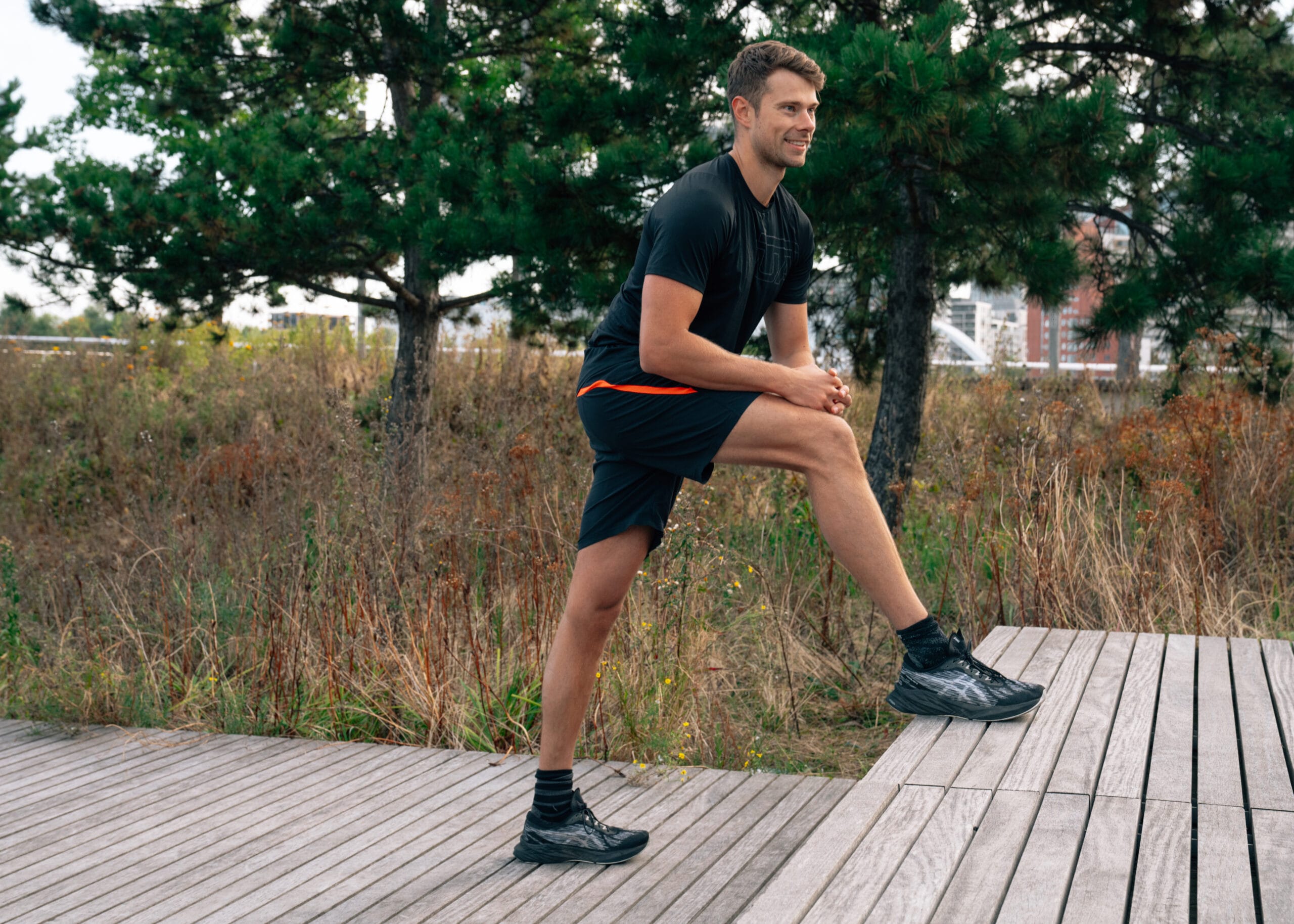 man stretching legs outside