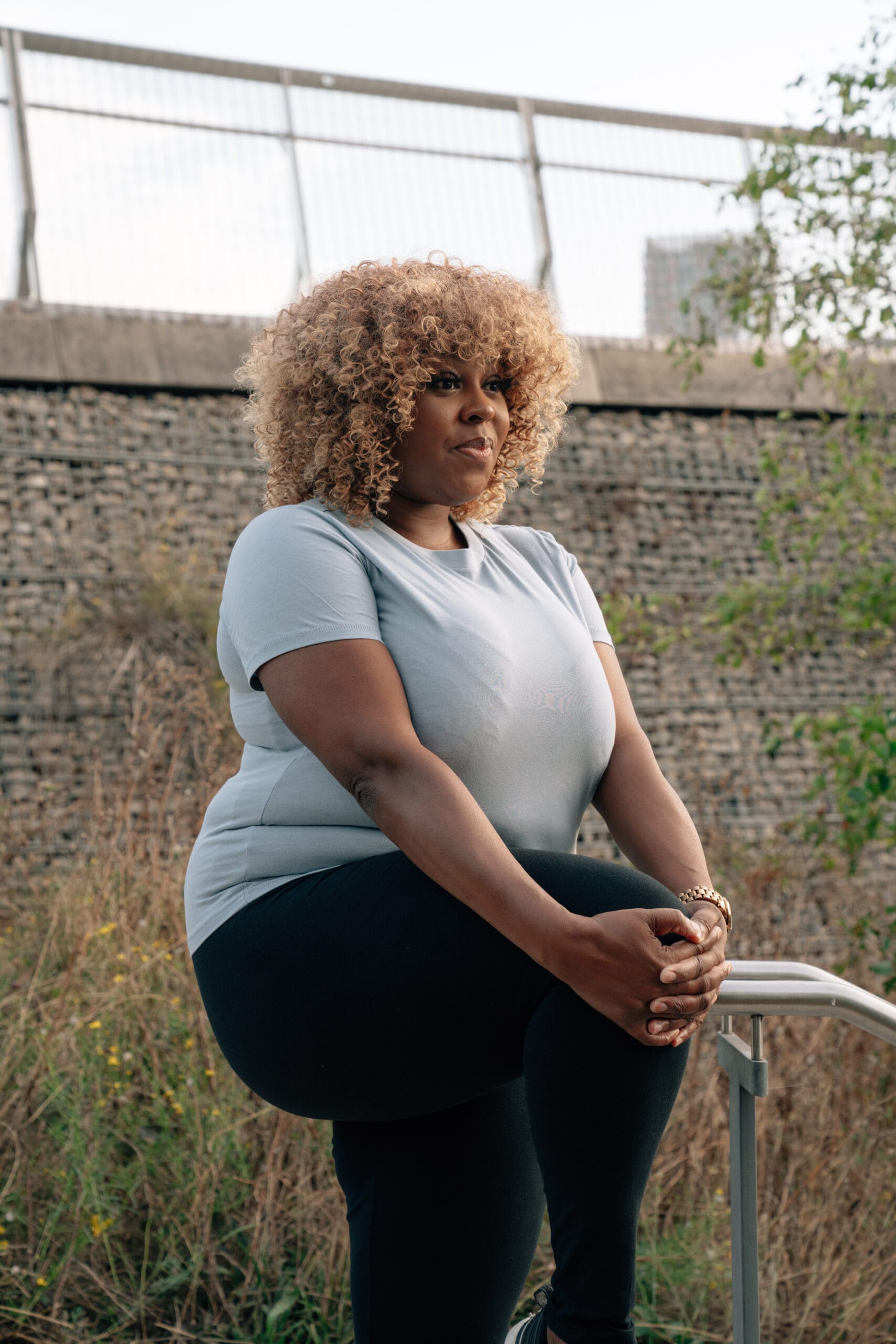 woman stretching legs outside