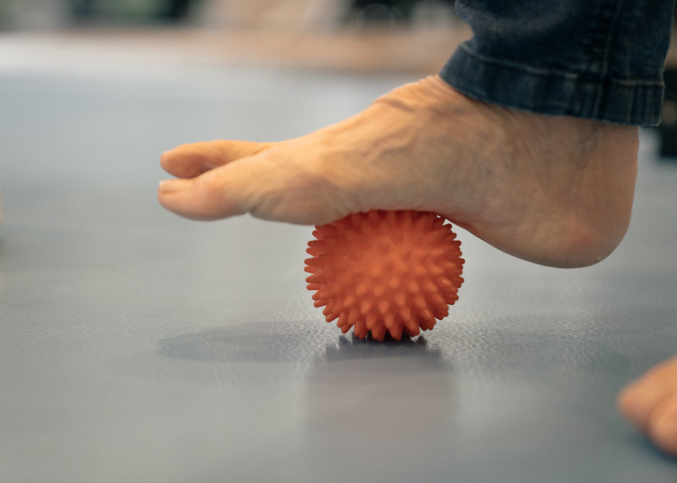 Foot on ball for podiatry exercise