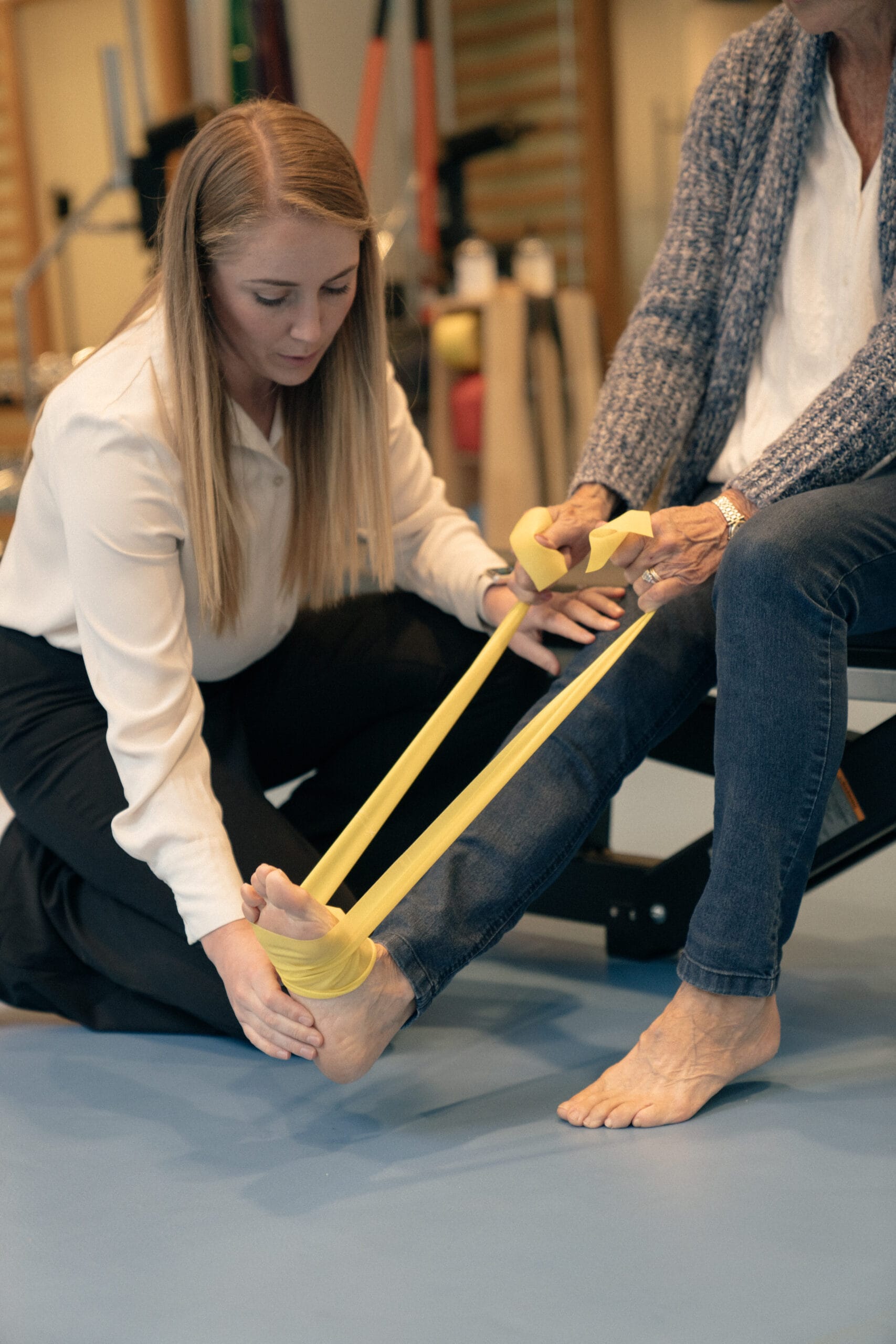 clinician showing patient stretch band
