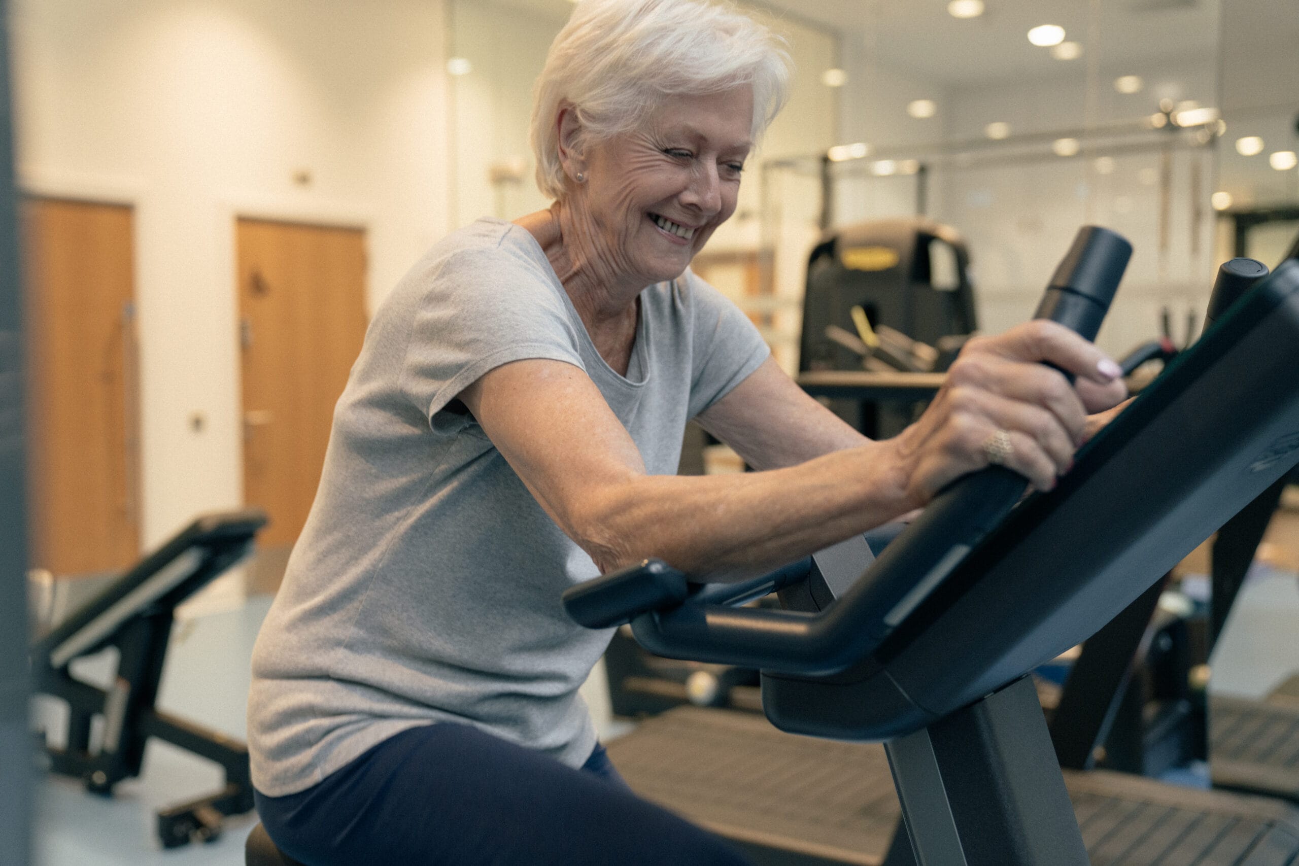 lady smiling close up on exercise bike