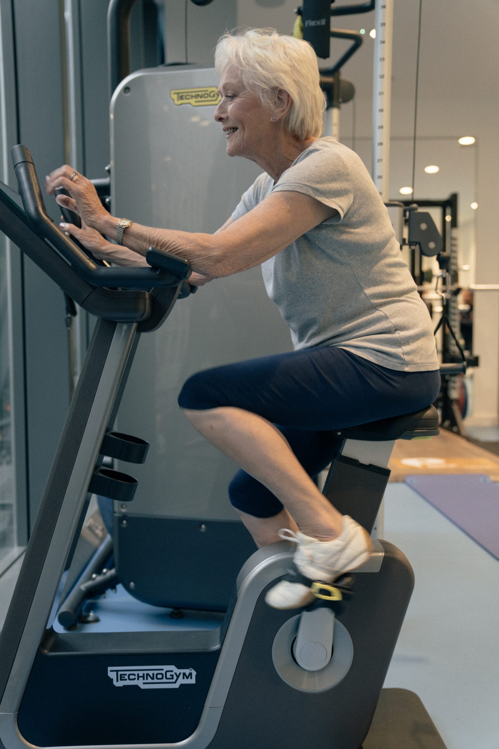 older woman on exercise bike