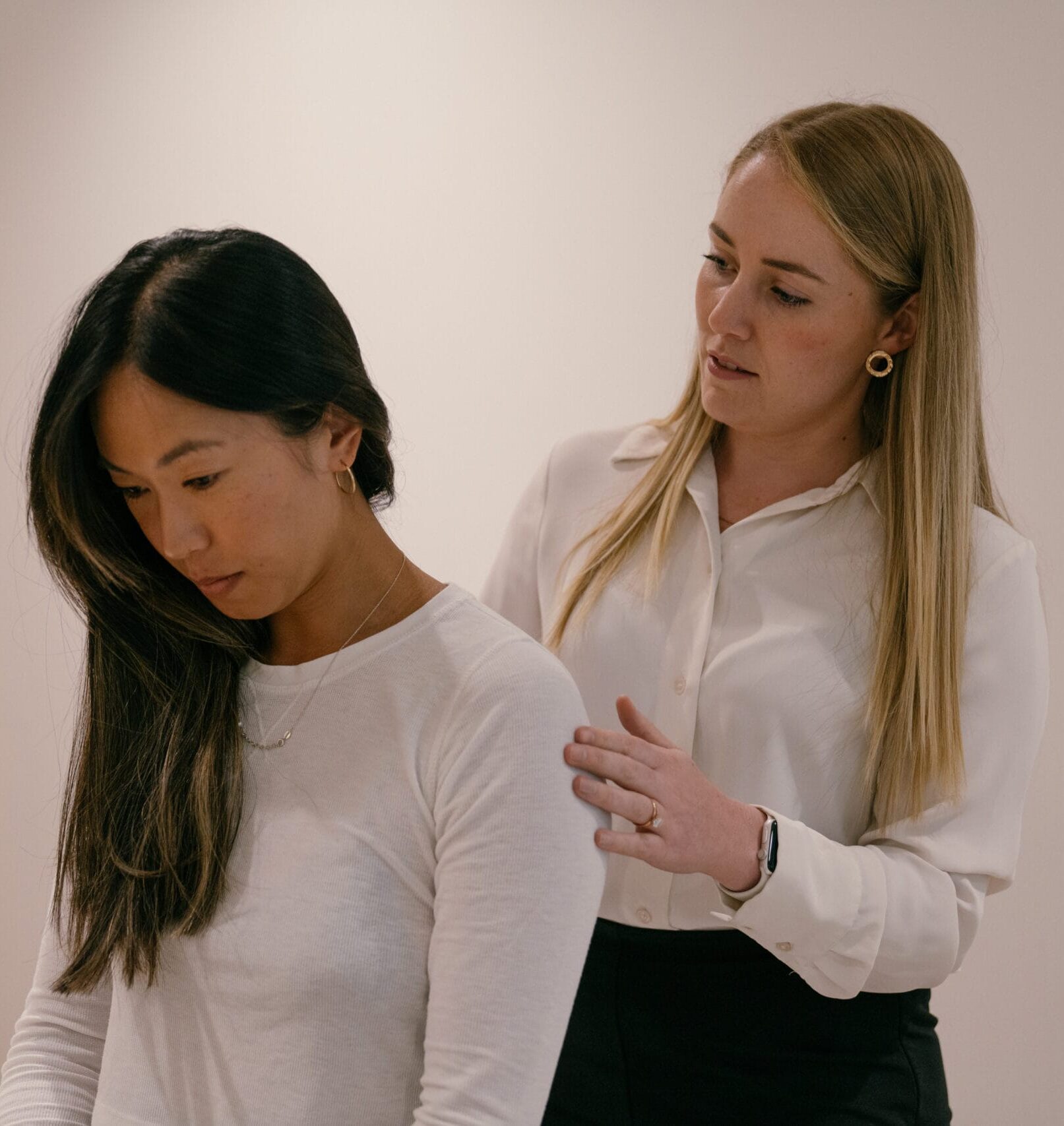 clinician assessing patient neck