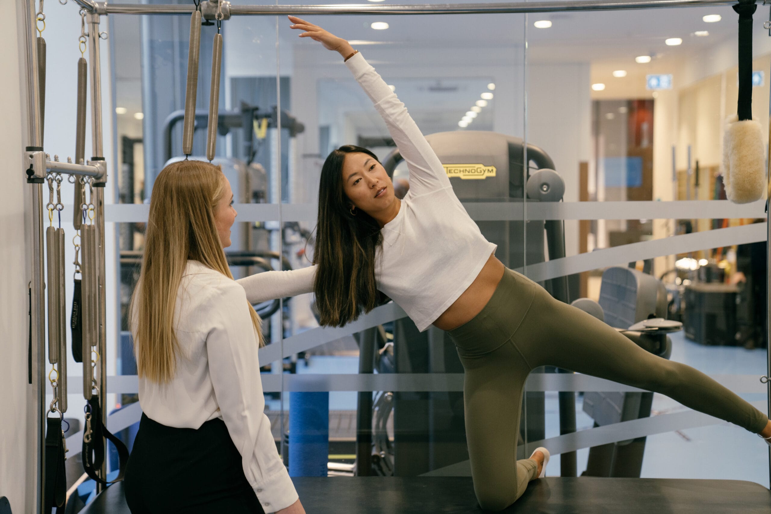 patient in a stretch in Pilates studio