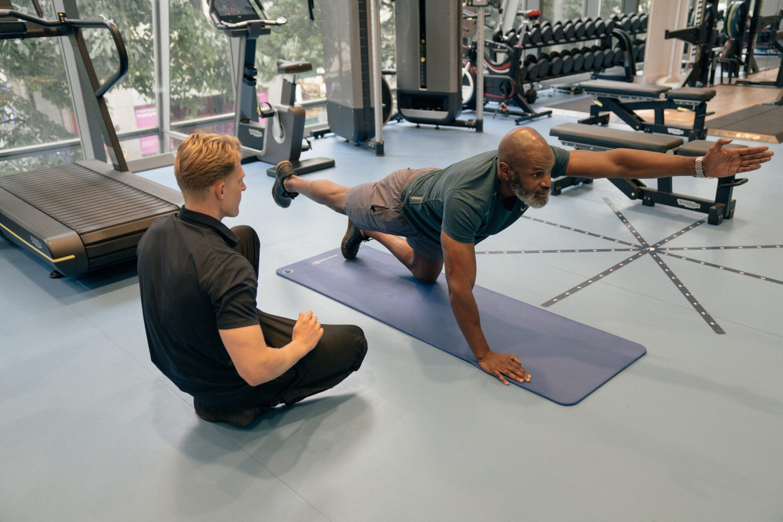 Man stretching with clinician