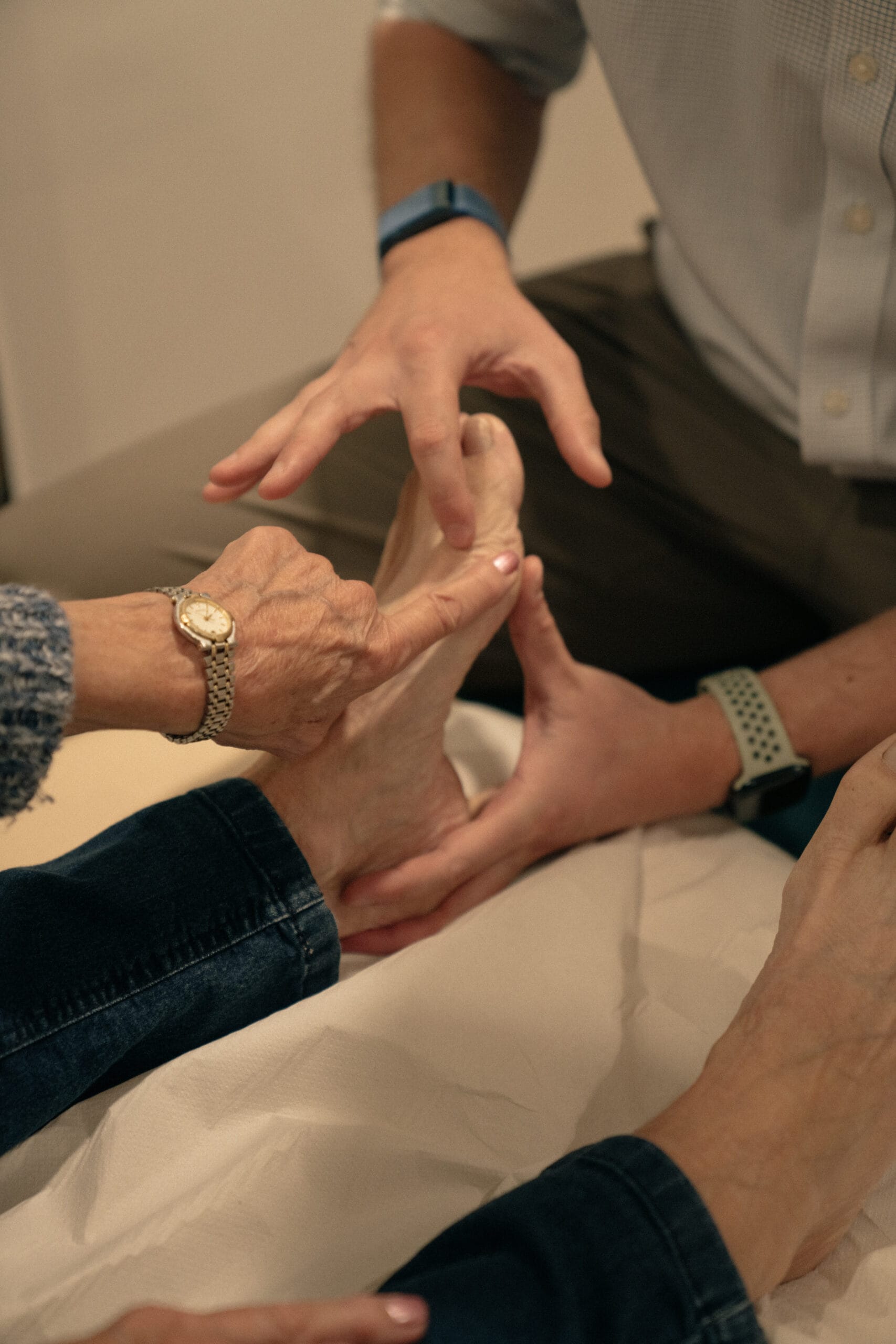 Close up of patient highlight pain on their foot to clincian