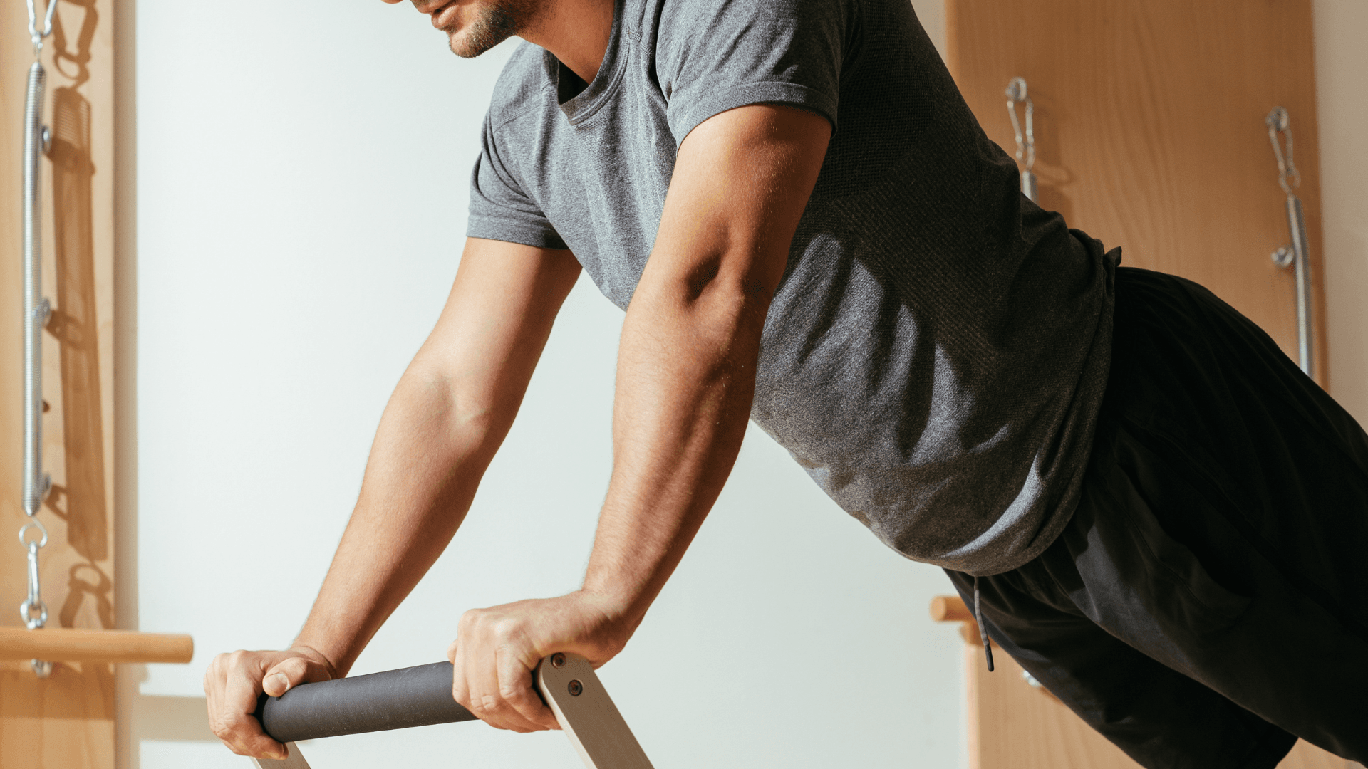 man stretching for Pilates exercise